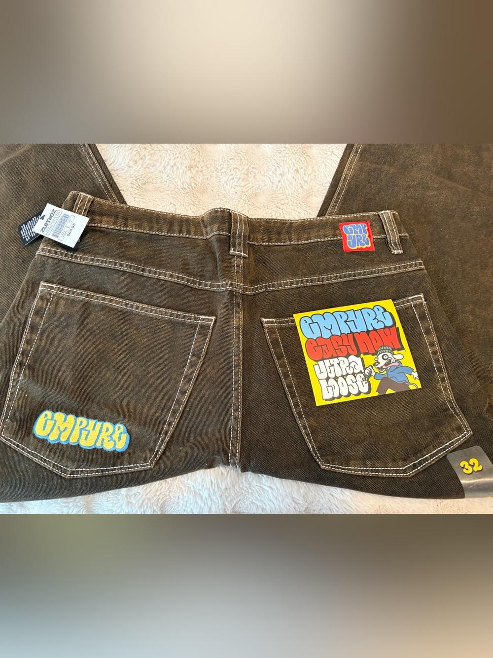 Empyre Brown Denim Jeans with Colorful Back Pocket Graphics